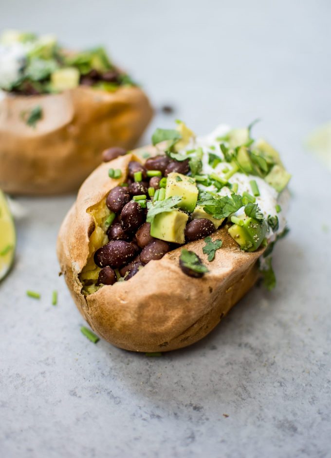 stuffed sweet potatoes with black beans and lime dressing close-up