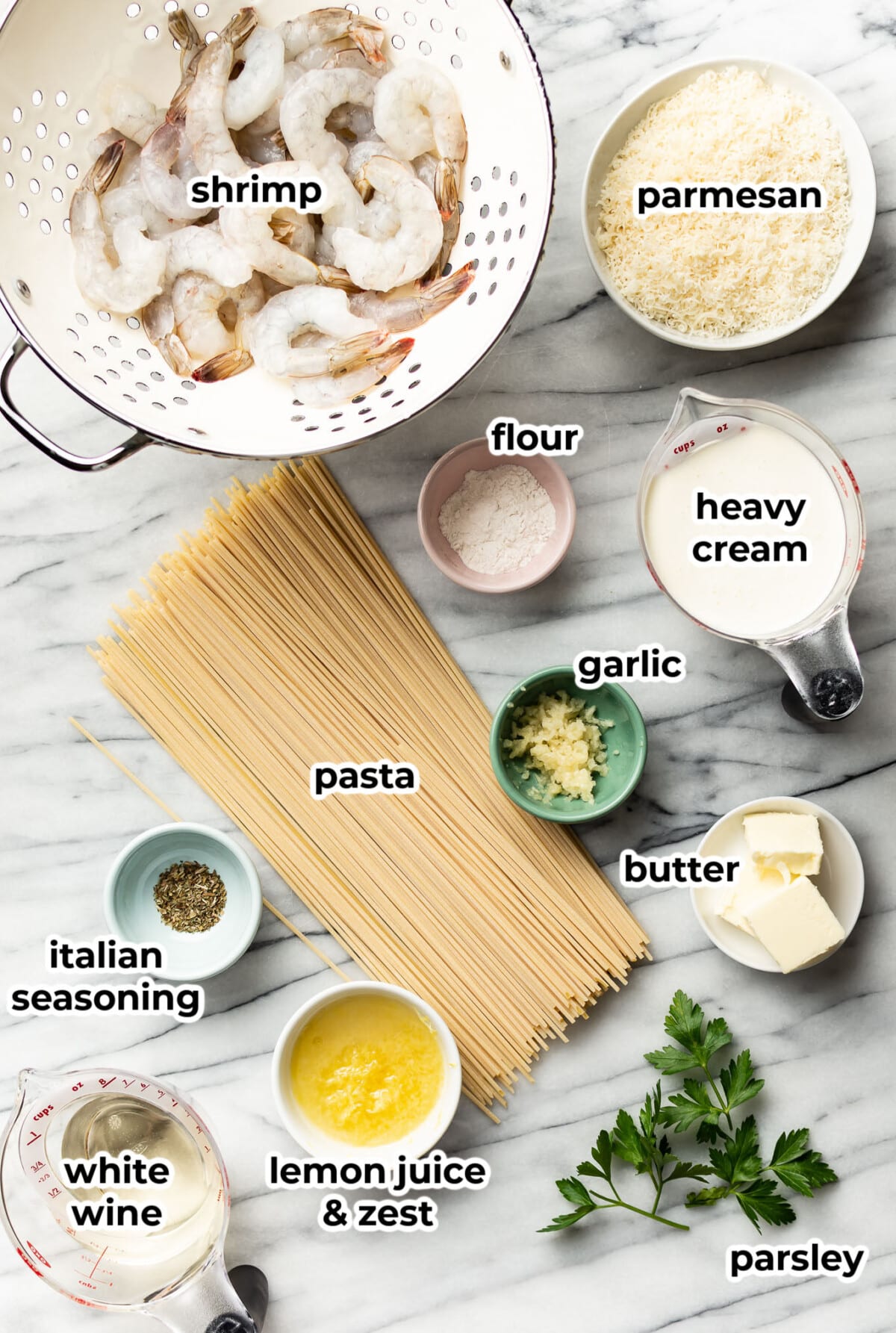 ingredients for creamy lemon shrimp pasta in prep bowls