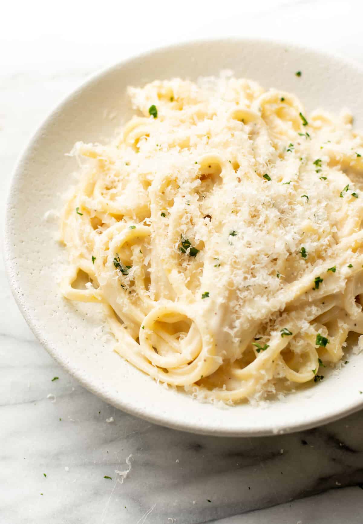 a bowl of creamy garlic pasta