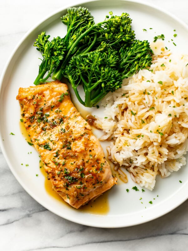 a plate with honey garlic salmon, rice, and broccolini