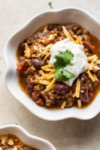 This fast and easy Instant Pot beef chili is crazye fast in your electric prescertain cooker. The perfect family friendly game day recipe!