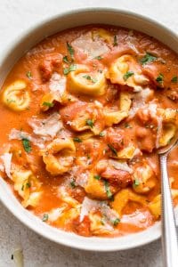 This easy tomato tortellini soup is fast and delicious! Cheese tortellini and cream make this one consolationing soup.