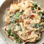 a bowl of chicken bacon spinach pasta