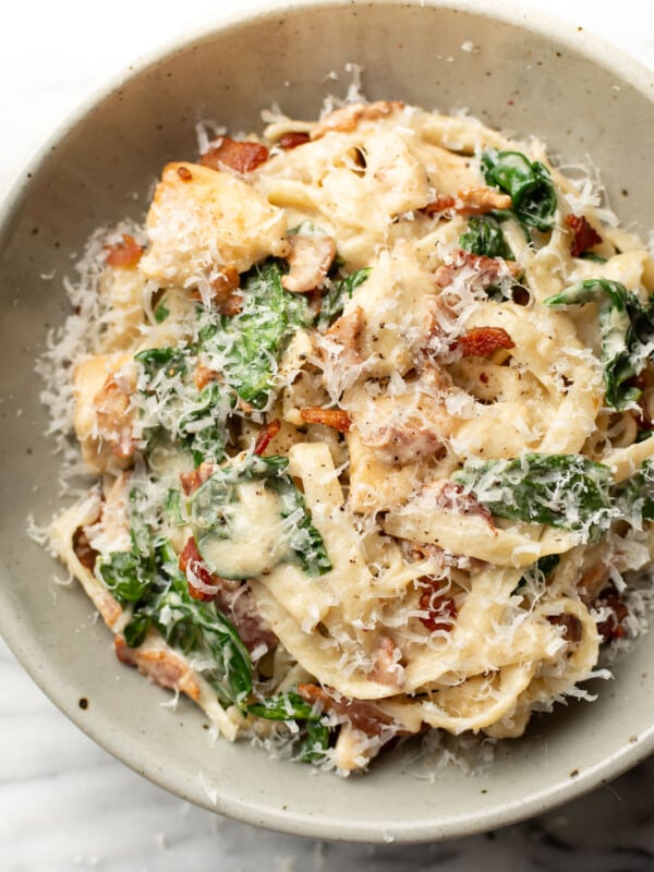 a bowl of chicken bacon spinach pasta