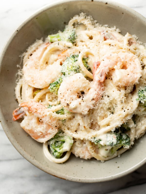 a bowl of creamy shrimp and broccoli pasta