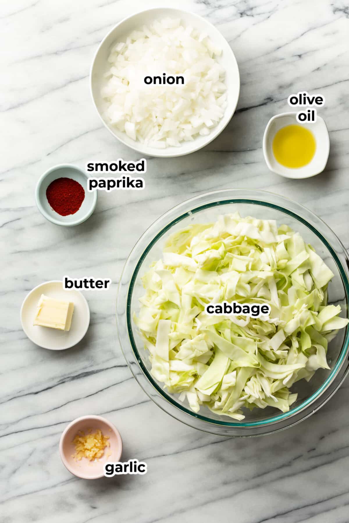 ingredients for sauteed cabbage in prep bowls