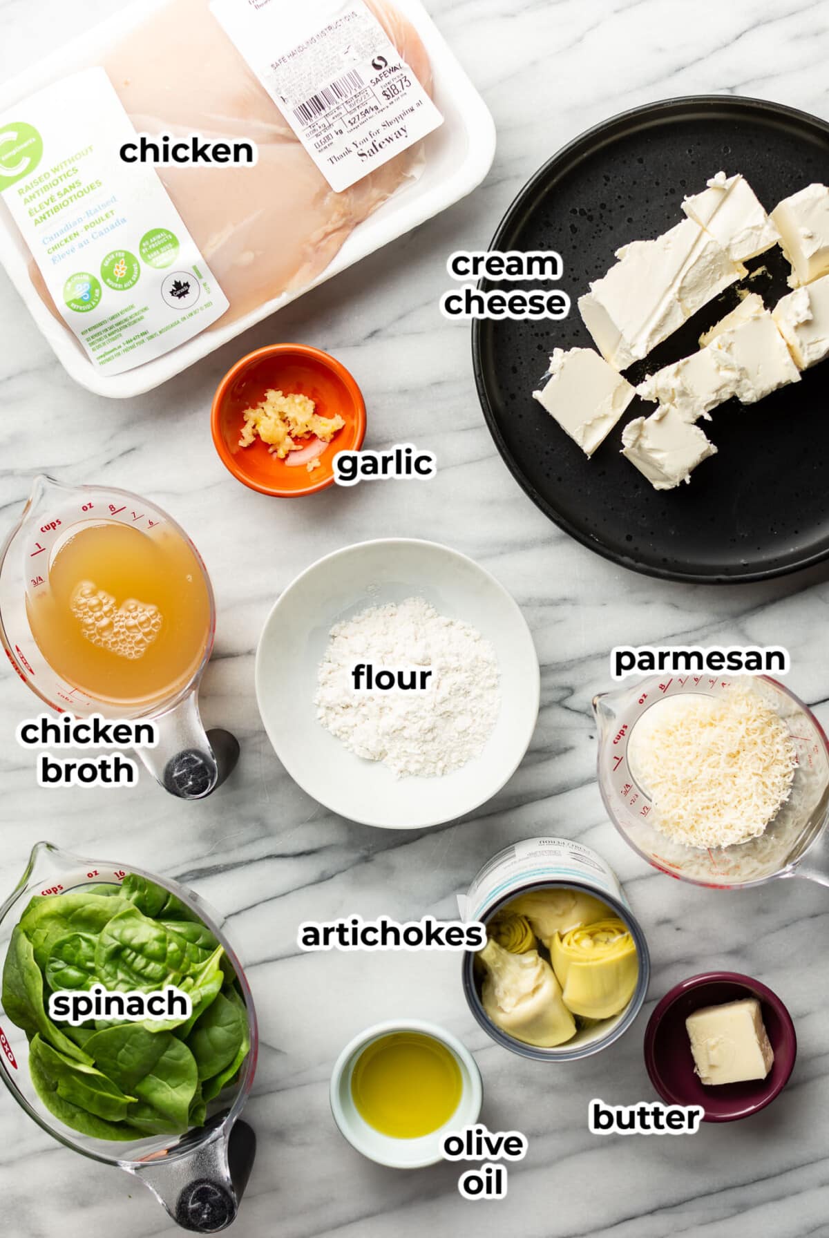 ingredients for spinach artichoke chicken in prep bowls