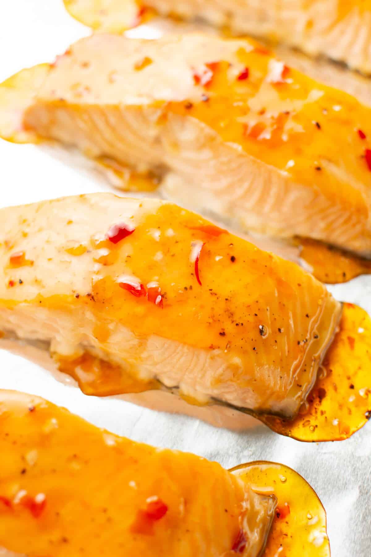 closeup of sweet chili salmon on a baking sheet