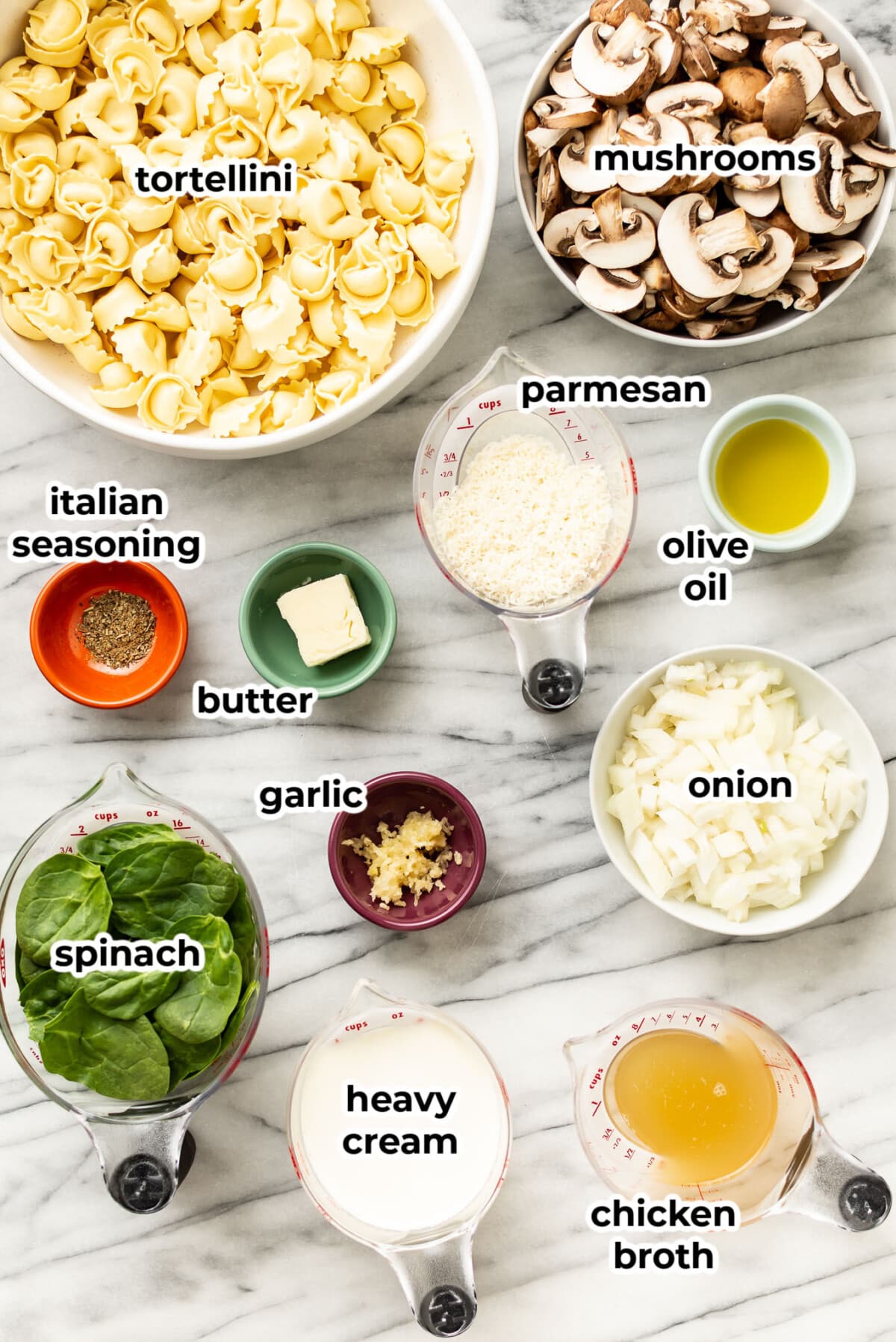 ingredients for one pan spinach mushroom tortellini in prep bowls