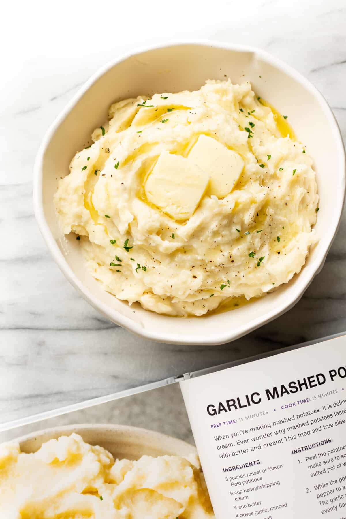 a bowl of mashed potatoes next to the salt and lavender cookbook