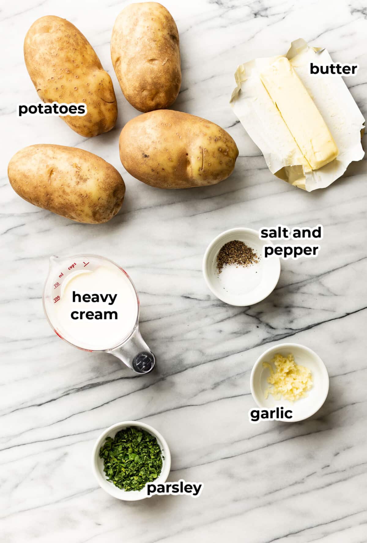 ingredients for garlic mashed potatoes in prep bowls