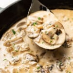 a skillet with marsala sauce and a serving spoon