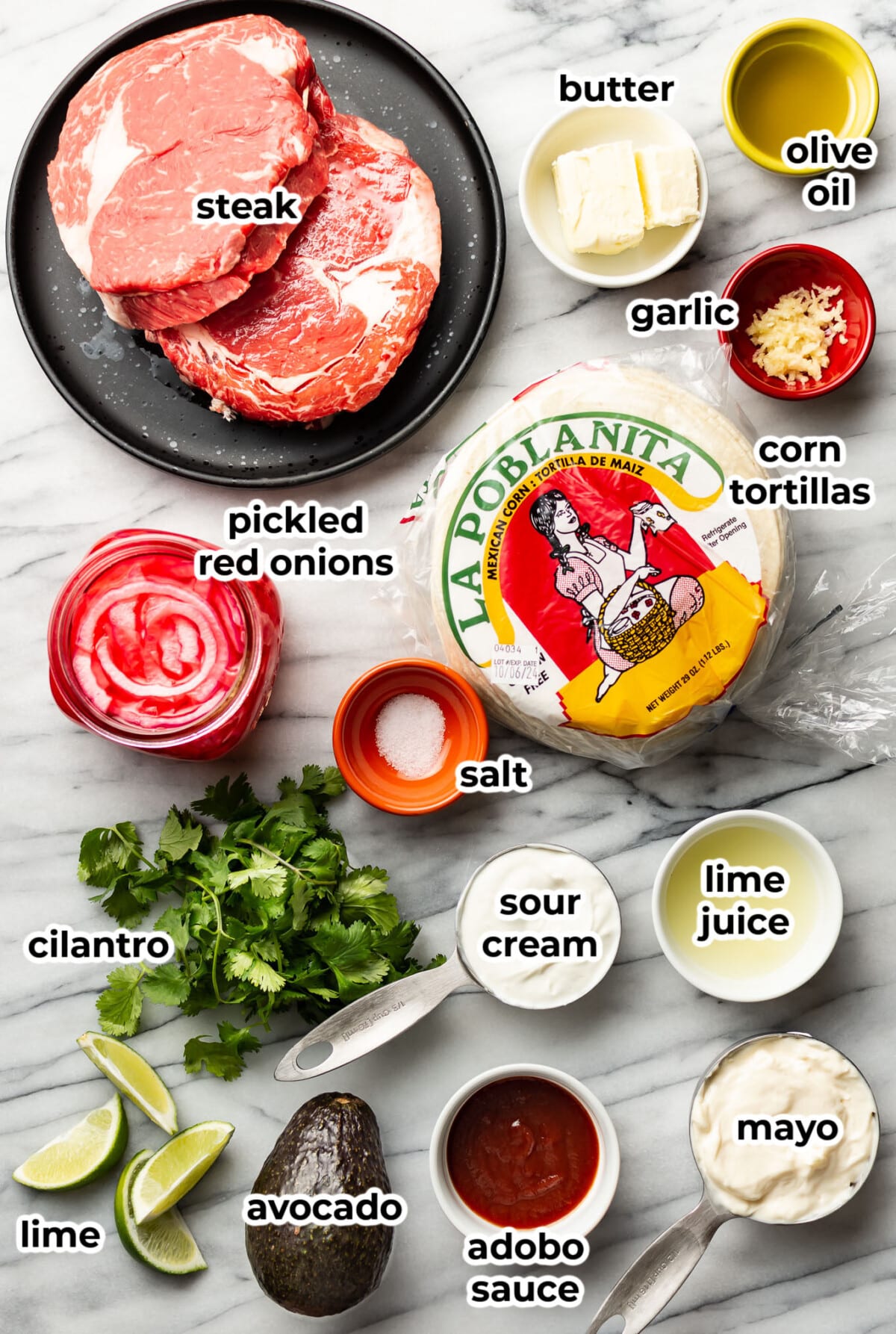 ingredients for steak tacos in prep bowls