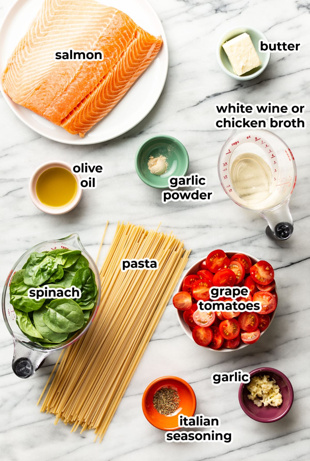 ingredients for tomato spinach salmon pasta in prep bowls