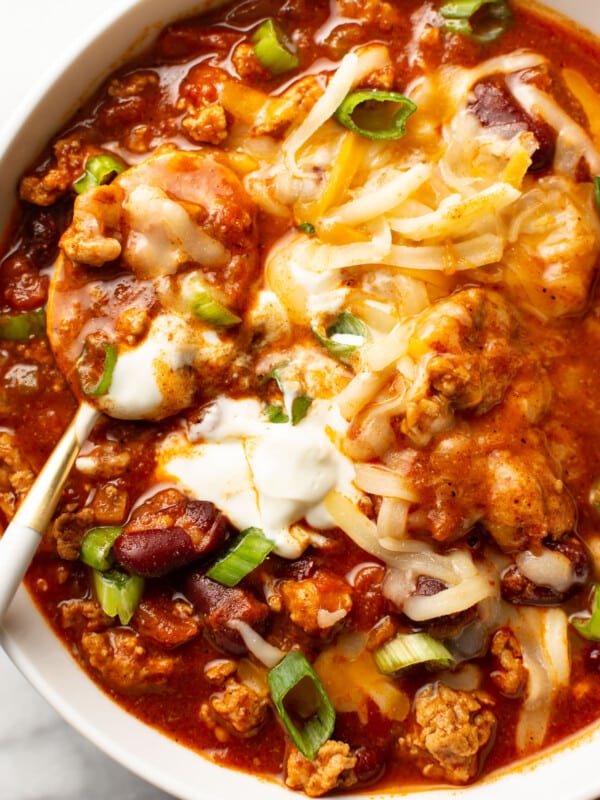 a bowl of turkey chili with a spoon