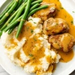 a plate with honey mustard pork tenderloin, green beans, and mashed potatoes