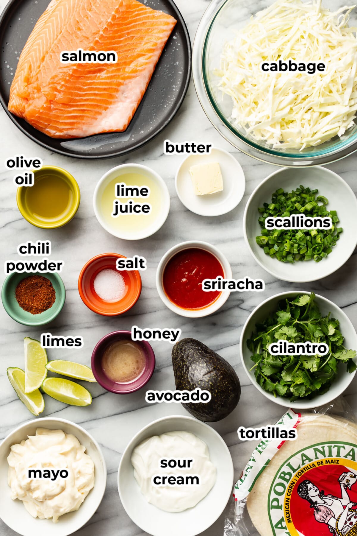 ingredients for salmon tacos in prep bowls