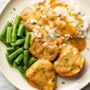 a plate with ranch pork tenderloin, rice, and green beans