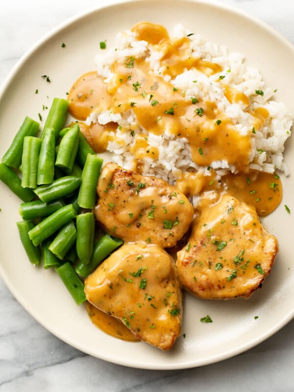 a plate with ranch pork tenderloin, rice, and green beans