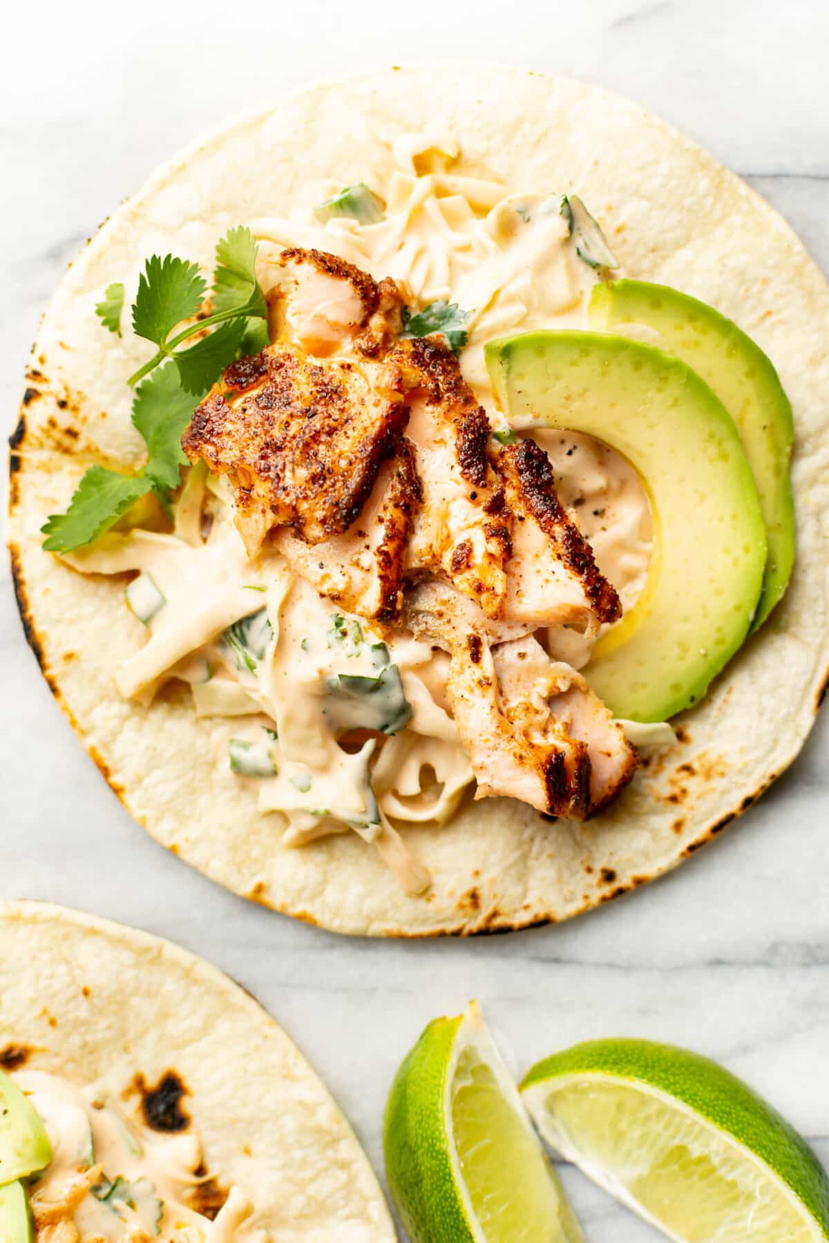 salmon tacos with lime wedges