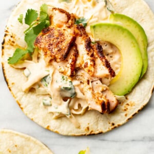 salmon tacos with lime wedges