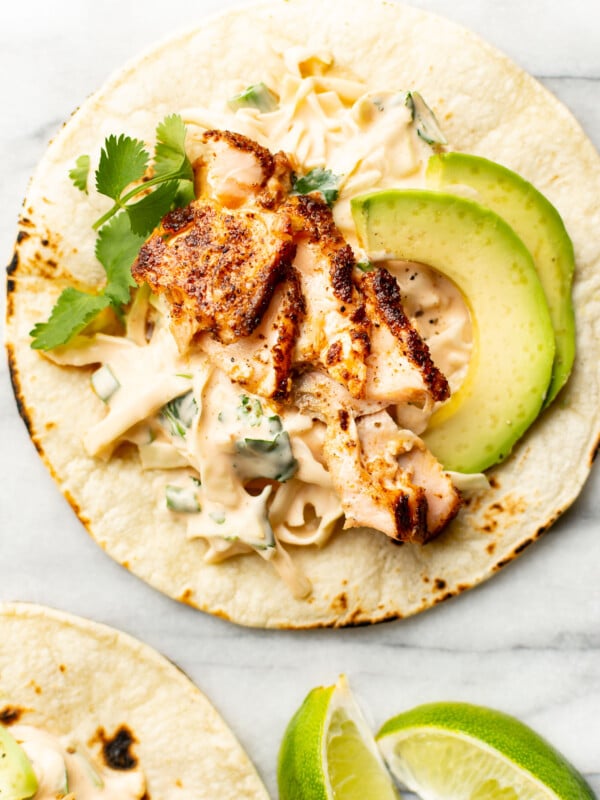 salmon tacos with lime wedges