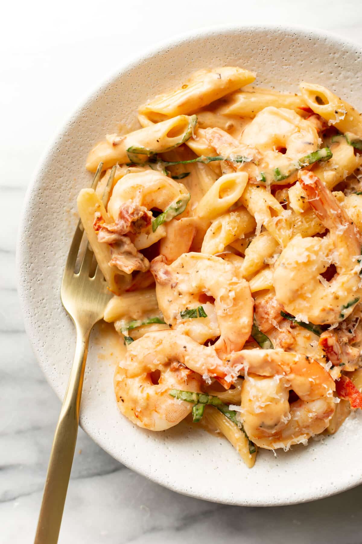 a bowl of marry me shrimp pasta with a fork