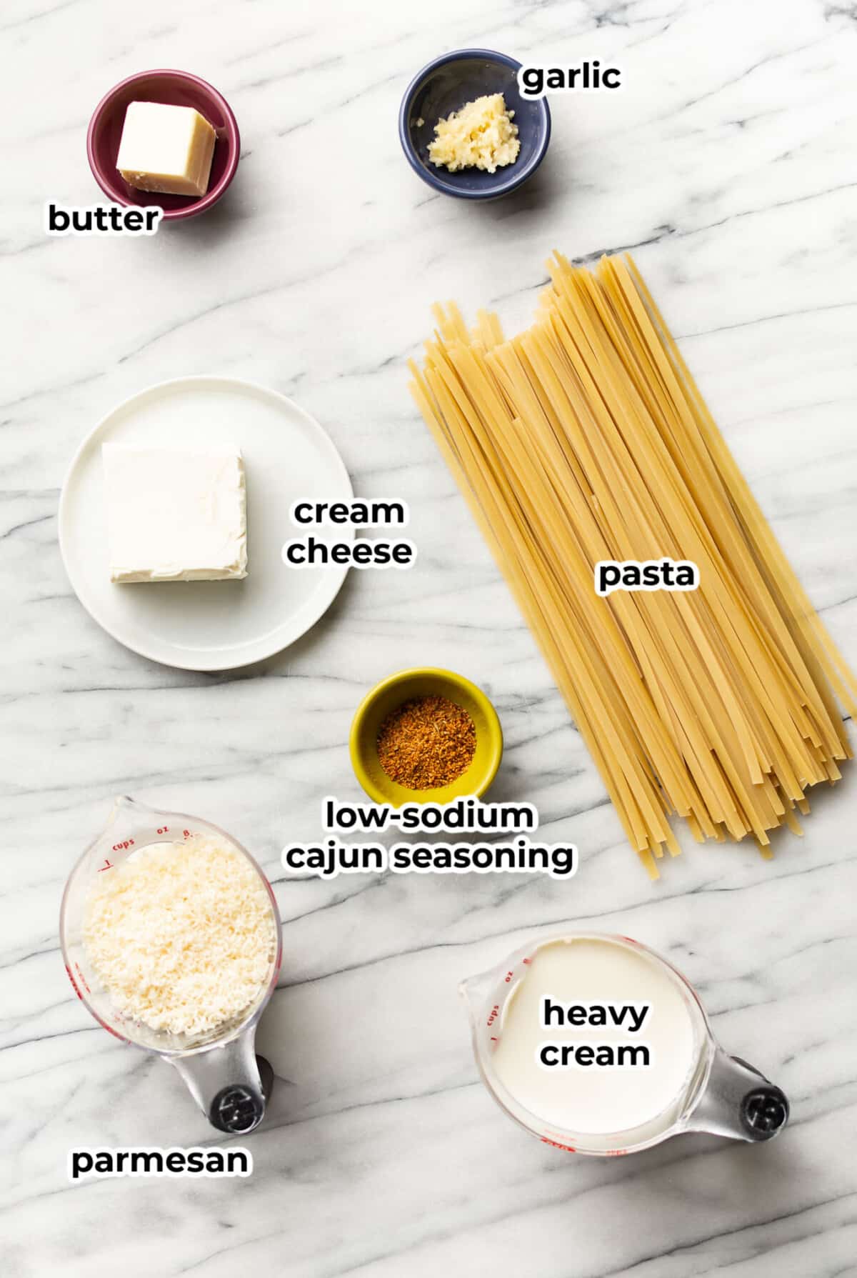 ingredients for cajun alfredo sauce in prep bowls