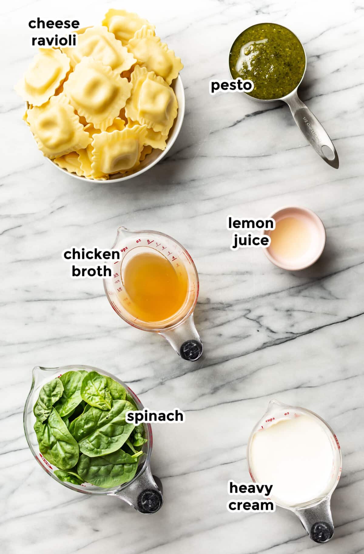 ingredients for creamy pesto ravioli in prep bowls