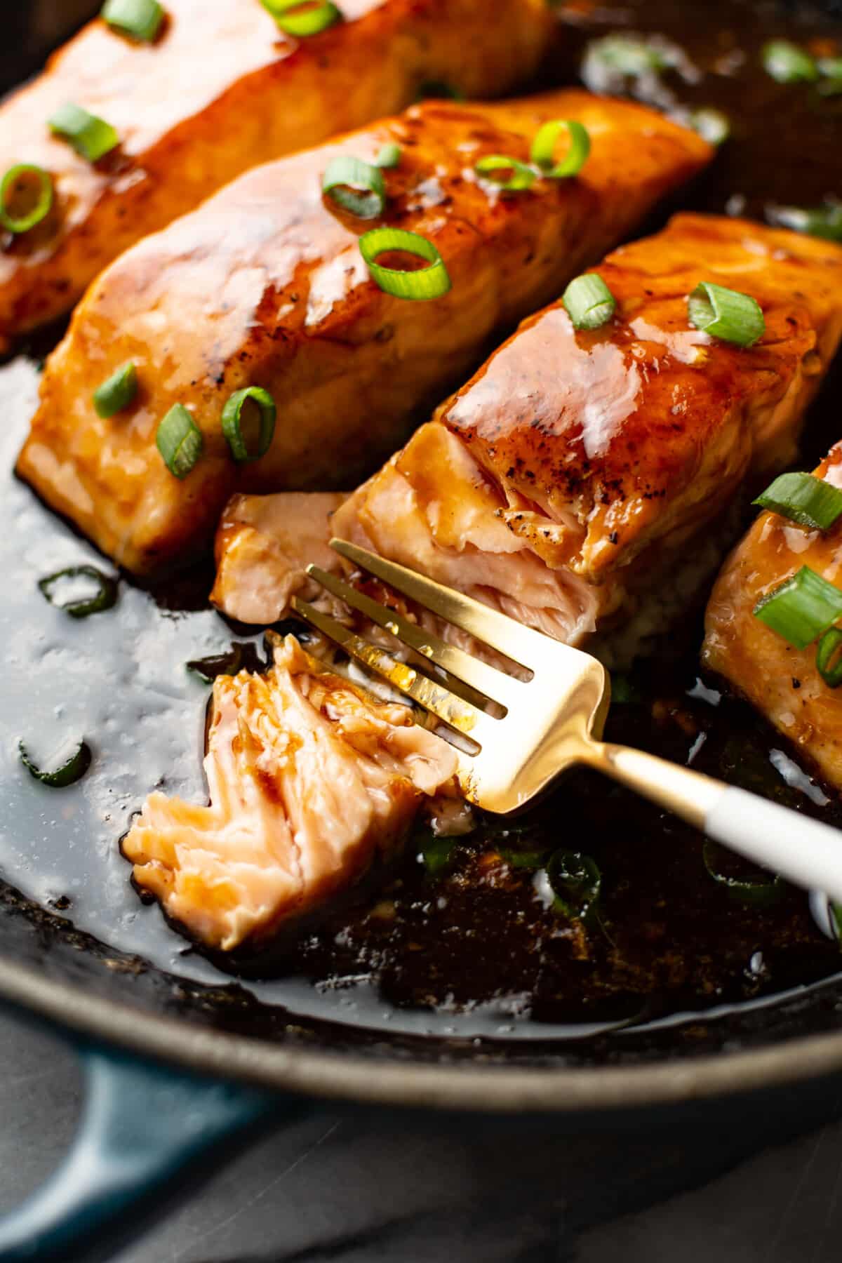 closeup of maple glazed salmon with a fork