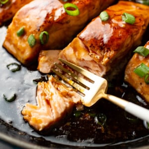 closeup of maple glazed salmon with a fork