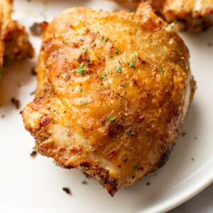 closeup of crispy air fryer chicken thighs on a plate