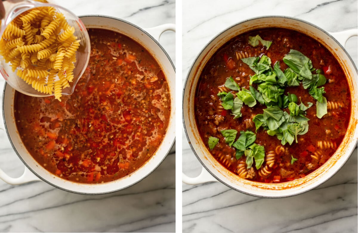 adding pasta and fresh basil to a pot with italian sausage soup