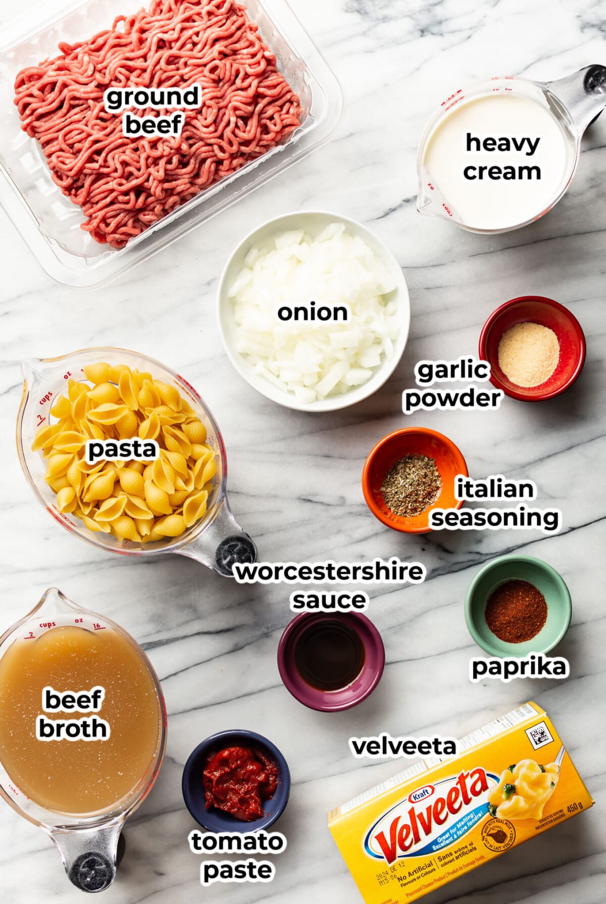 ingredients for one pot cheesy beef and shells in prep bowls