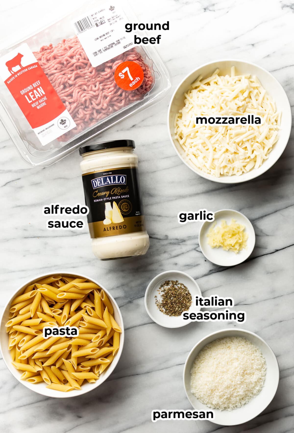 ingredients for ground beef alfredo bake in prep bowls