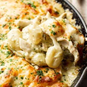 closeup of a skillet with pesto chicken gnocchi