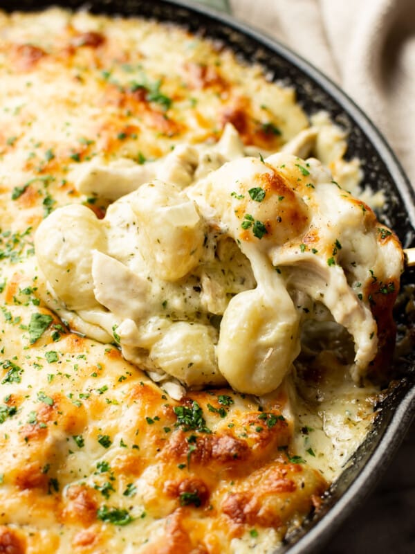 closeup of a skillet with pesto chicken gnocchi