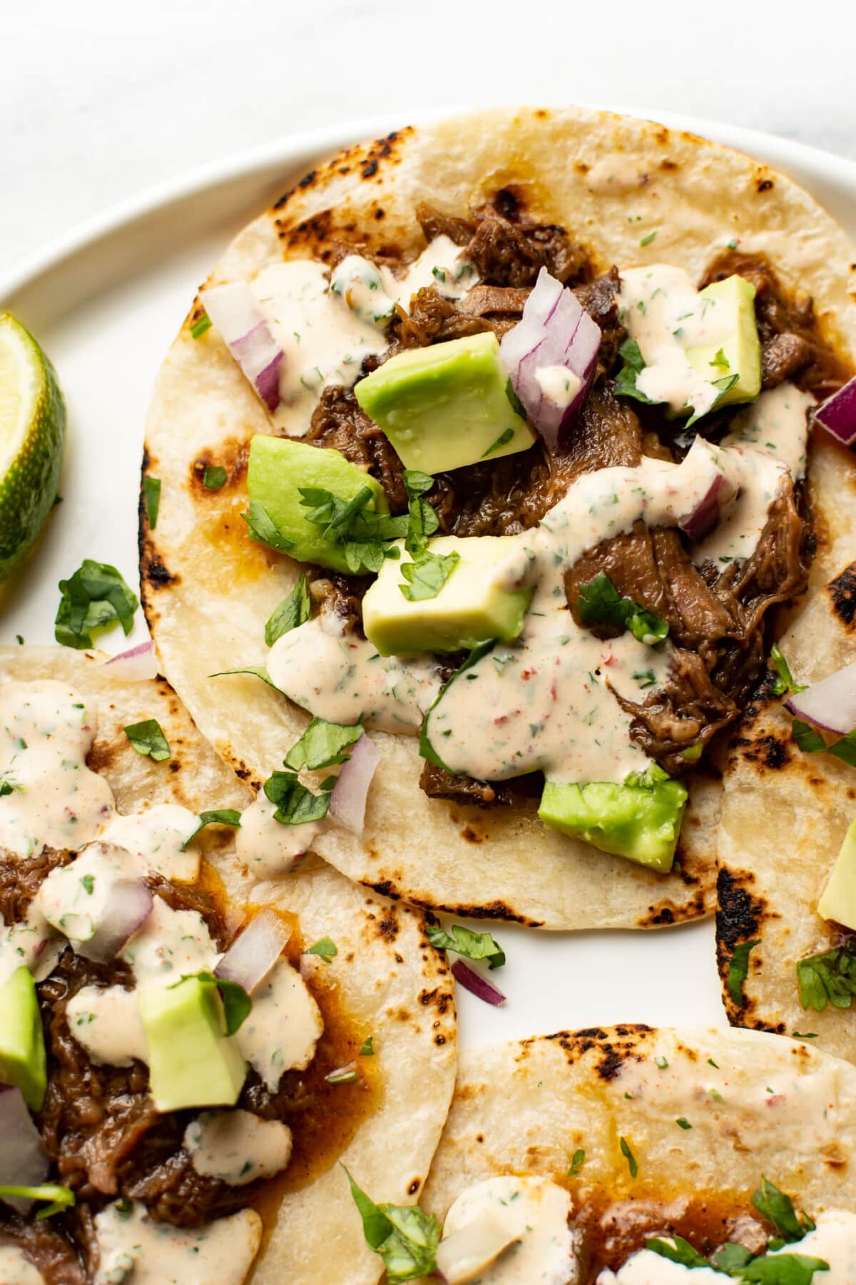 crockpot shredded beef tacos on a plate