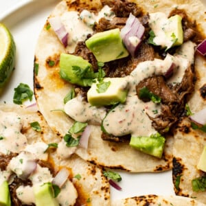 crockpot shredded beef tacos on a plate