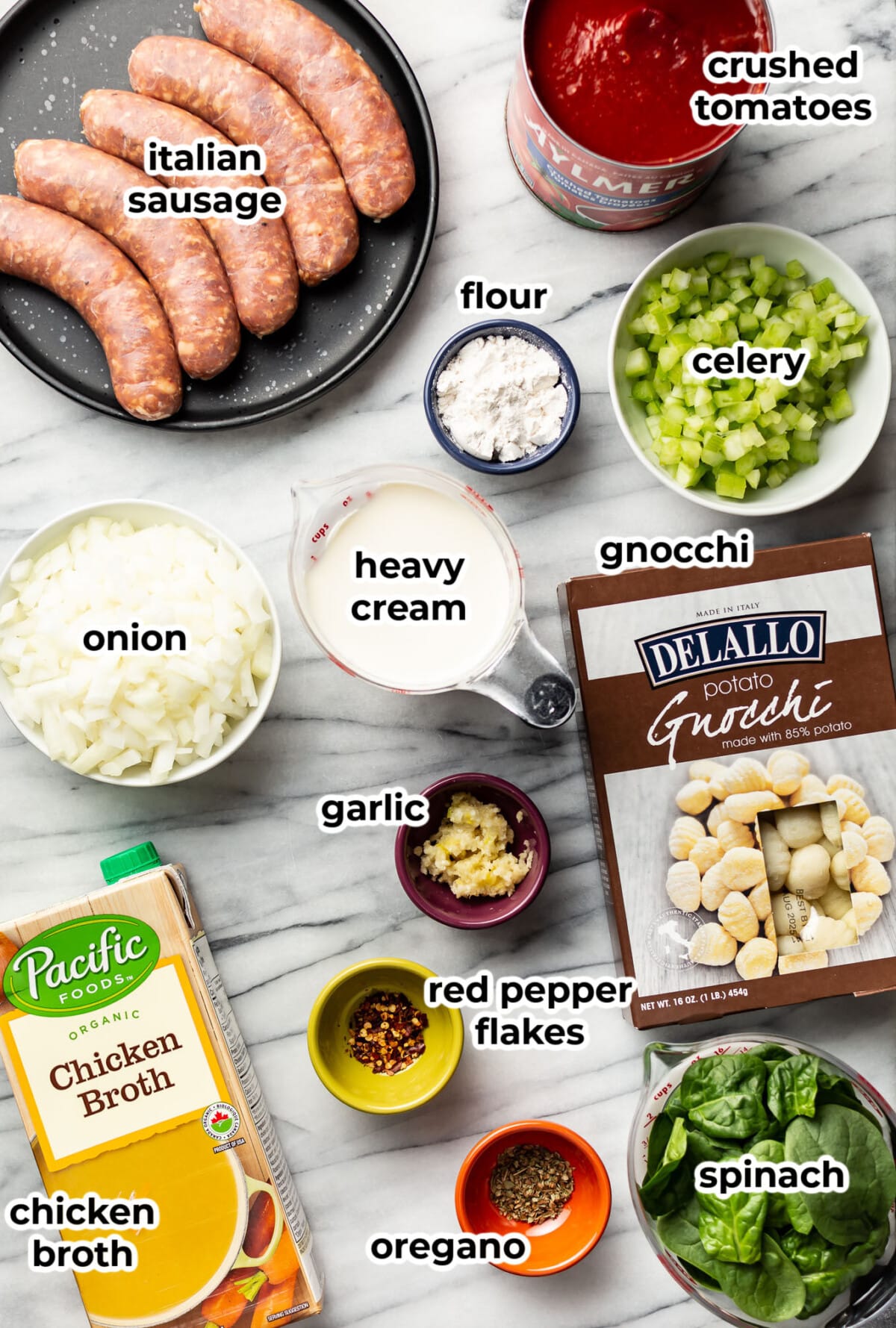 ingredients for creamy italian sausage gnocchi soup in prep bowls