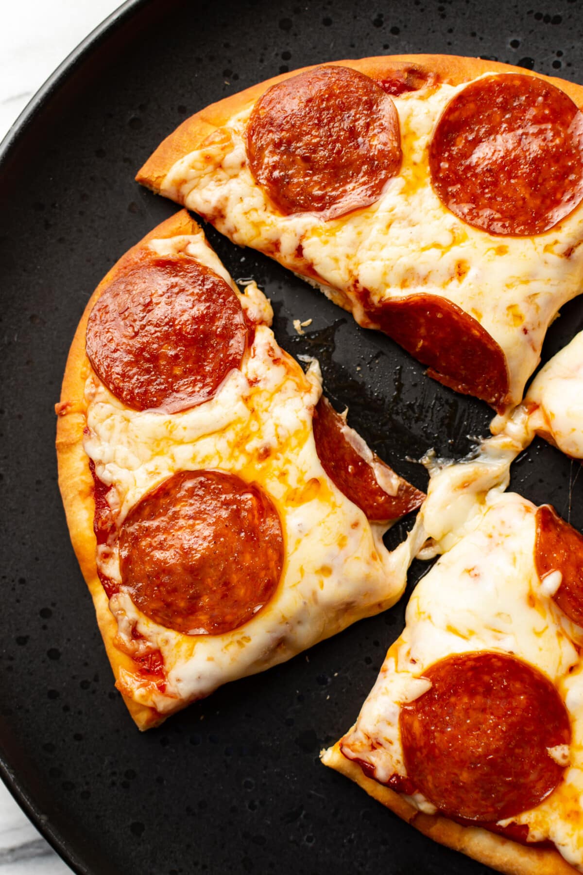 a plate with slices of naan pizza