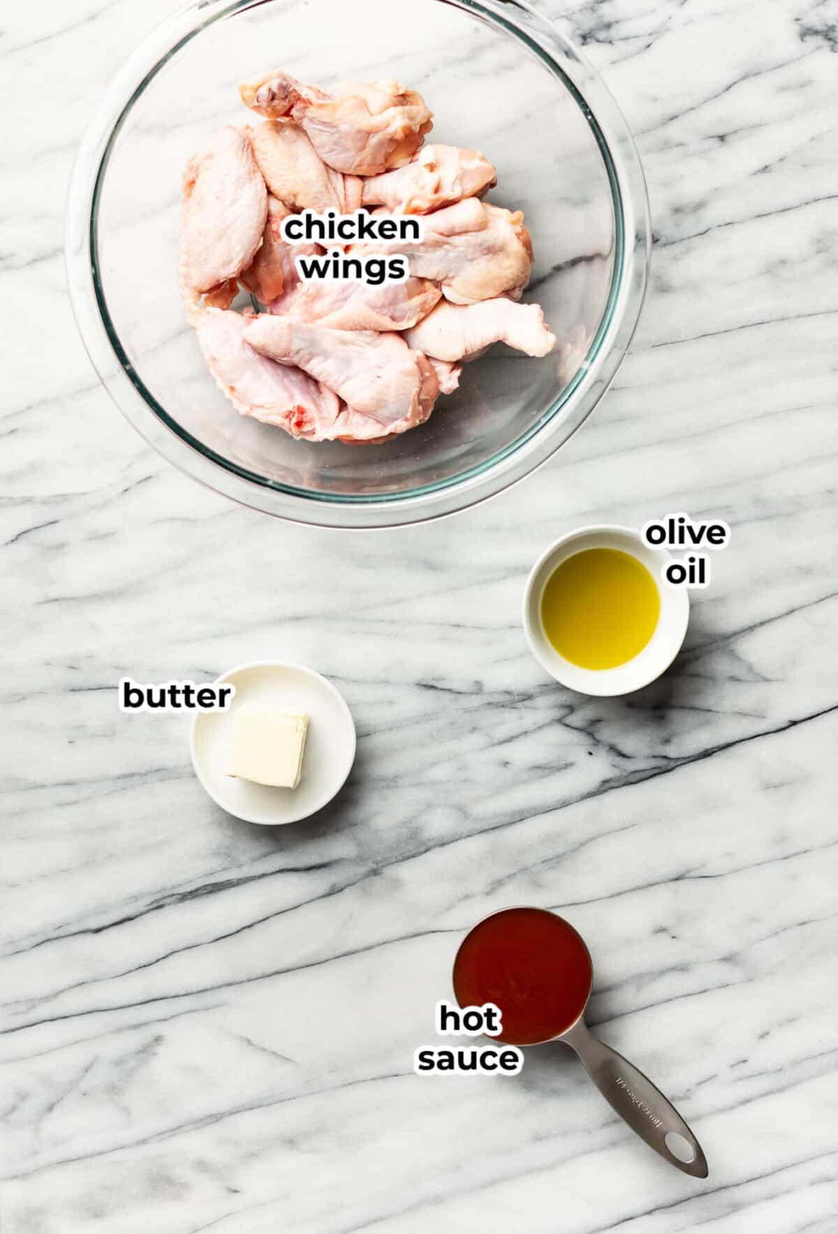 ingredients for air fryer buffalo wings in prep bowls