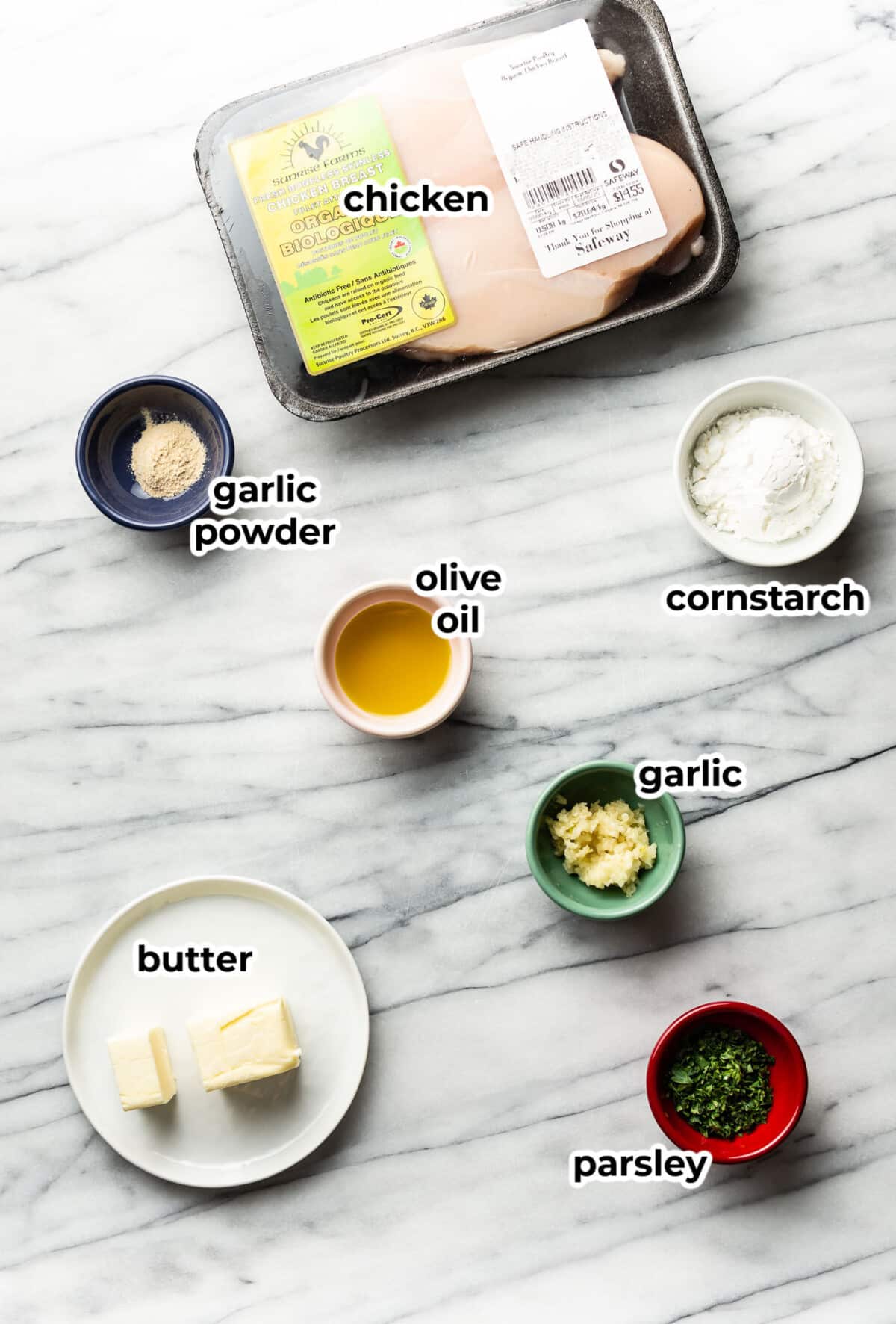 ingredients for garlic butter chicken bites in prep bowls