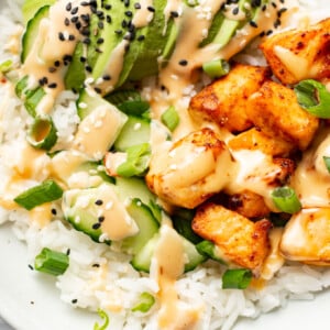 a bowl with air fryer salmon bites, rice, and avocado