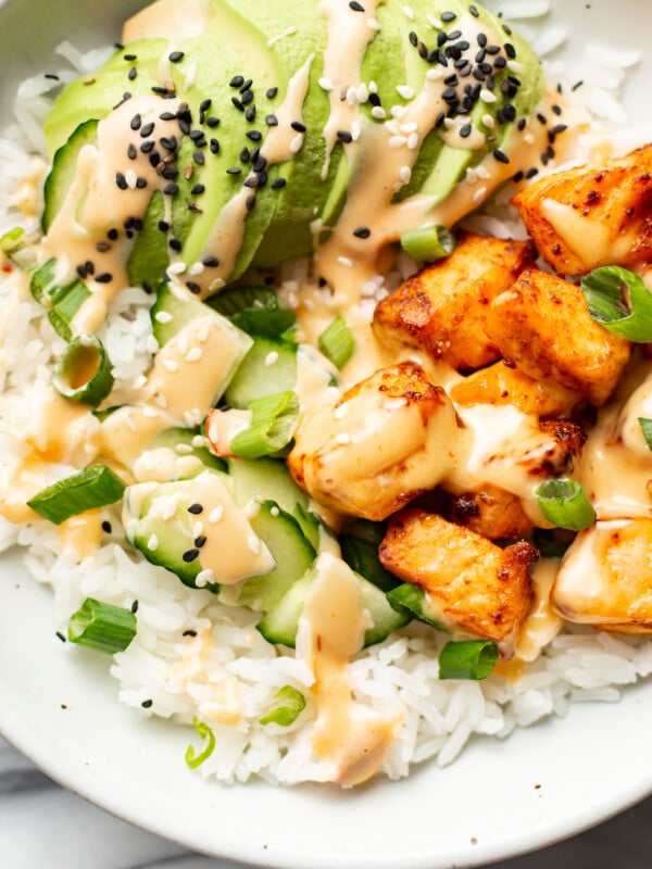 a bowl with air fryer salmon bites, rice, and avocado