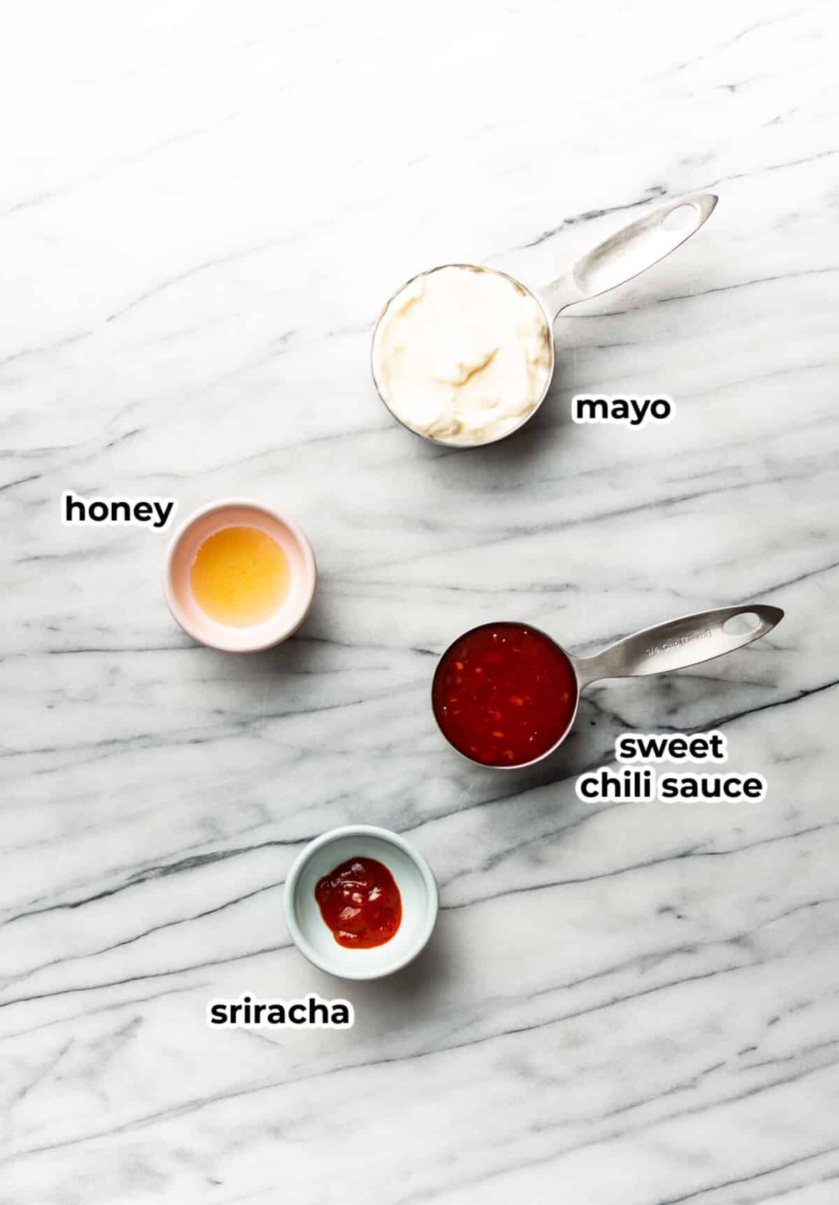 ingredients for bang bang sauce in prep bowls